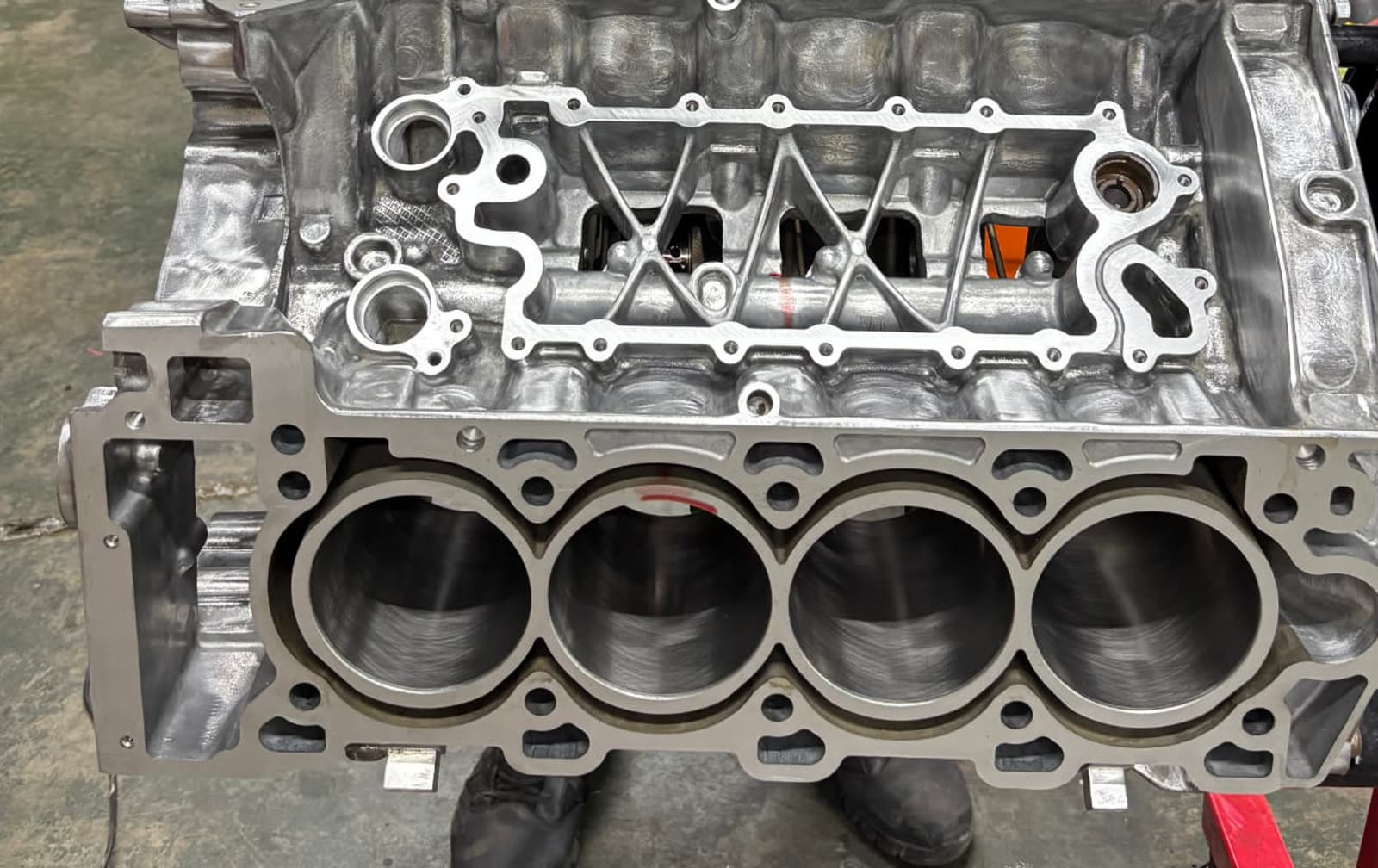 Machined aluminium engine block with open cylinder bores during a rebuild